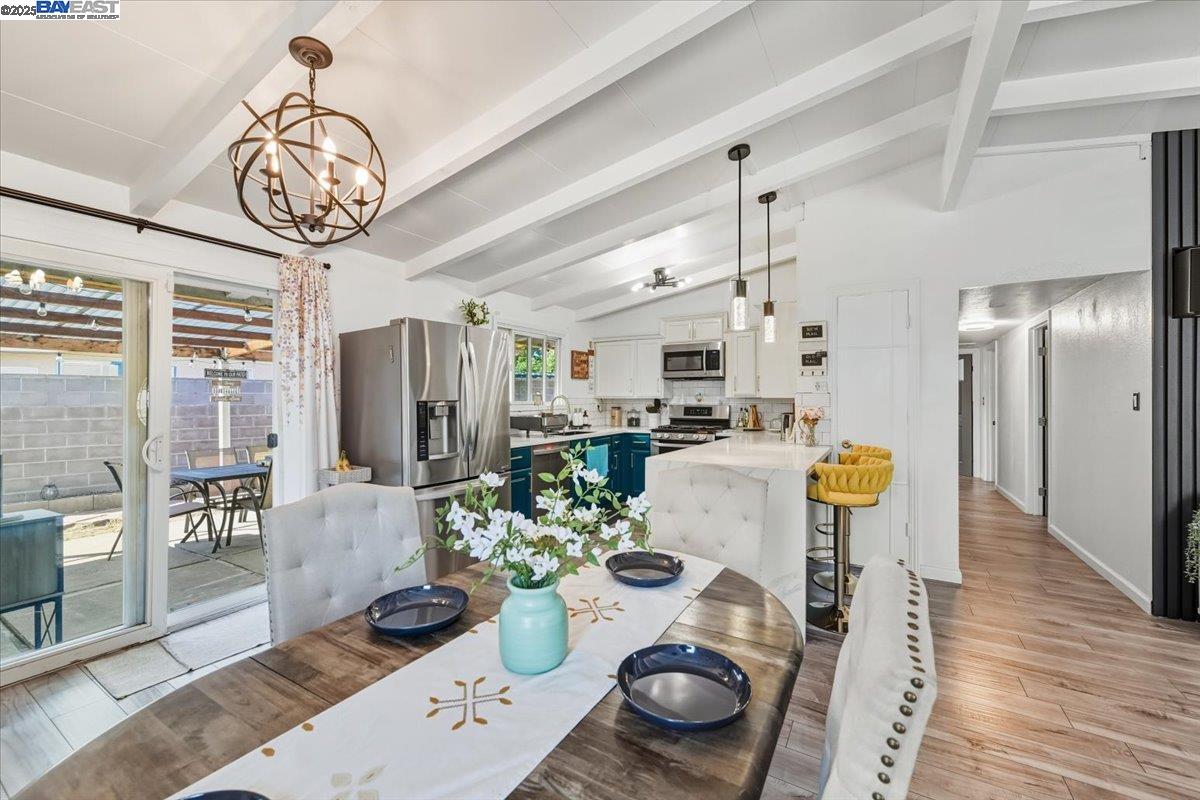 1481 Rieger Avenue Hayward, CA 94544 - Photo 19 of 53 a dining room with furniture and a chandelier