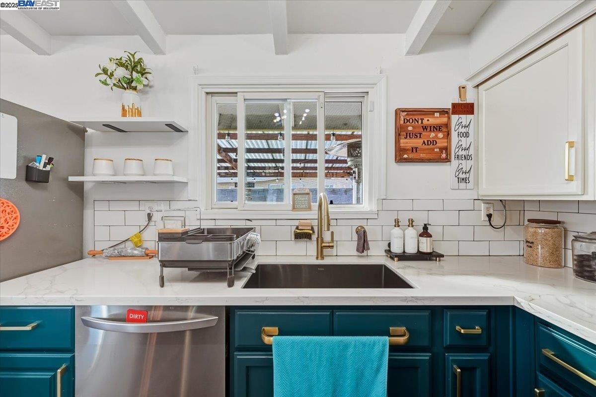 1481 Rieger Avenue Hayward, CA 94544 - Photo 26 of 53 a kitchen with a sink stove and cabinets