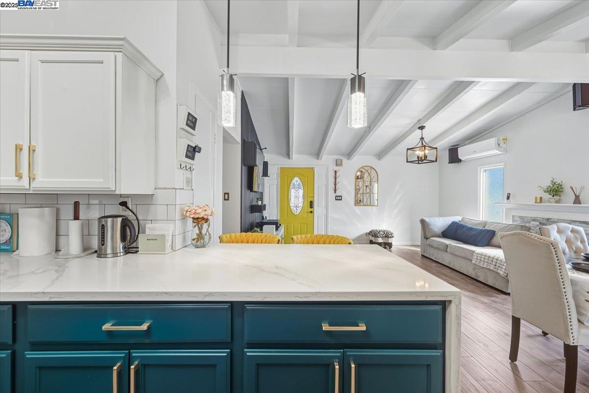 1481 Rieger Avenue Hayward, CA 94544 - Photo 27 of 53 a kitchen with a sink dishwasher and a refrigerator with wooden floor