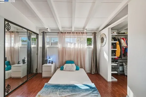 a room with furniture and flat screen tv