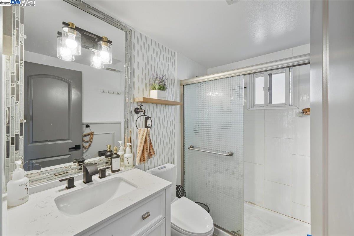 1481 Rieger Avenue Hayward, CA 94544 - Photo 42 of 53 a bathroom with a sink toilet and shower