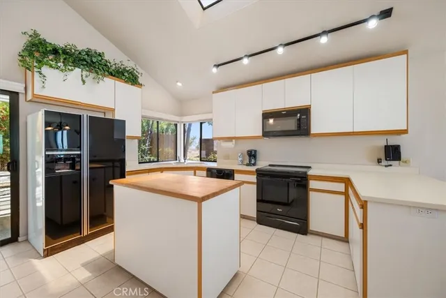 a dining room with a table and chairs