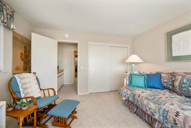 a view of a porch with furniture and a backyard