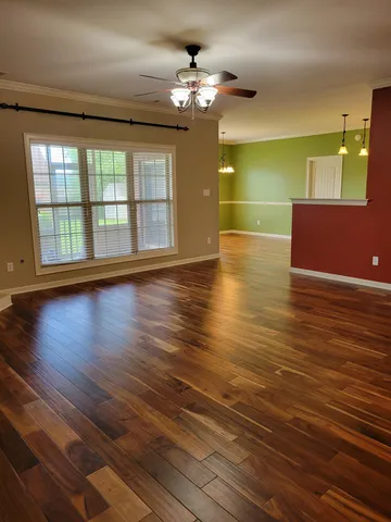 a view of an empty room with a fireplace