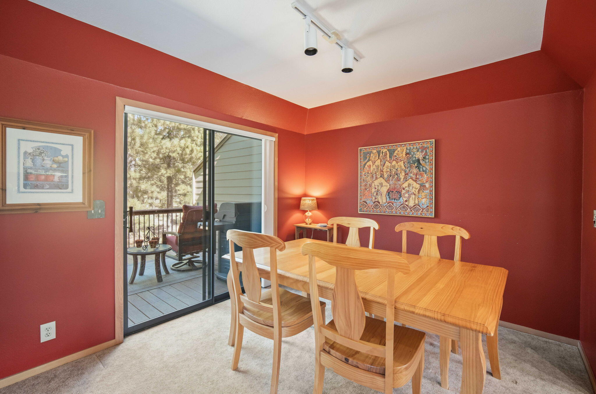 17682 Bittern Lane, Unit 31 Sunriver, OR 97707 - Photo 11 of 44 a view of a dining room with furniture large windows and wooden floor
