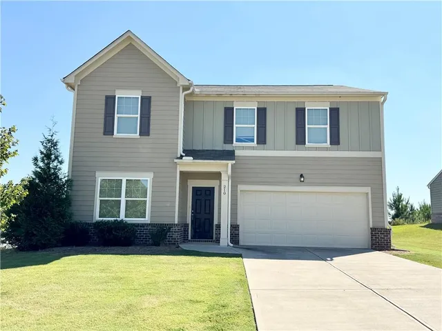 a view of house and yard with swimming pool
