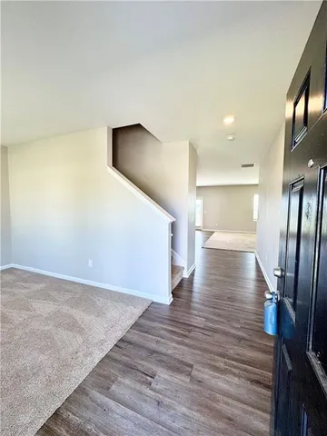 a view of a livingroom with wooden floor