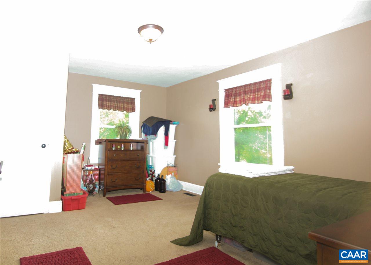 252 Shamrock Road Charlottesville, VA 22903 - Photo 11 of 18 a bed room with a bed and a window