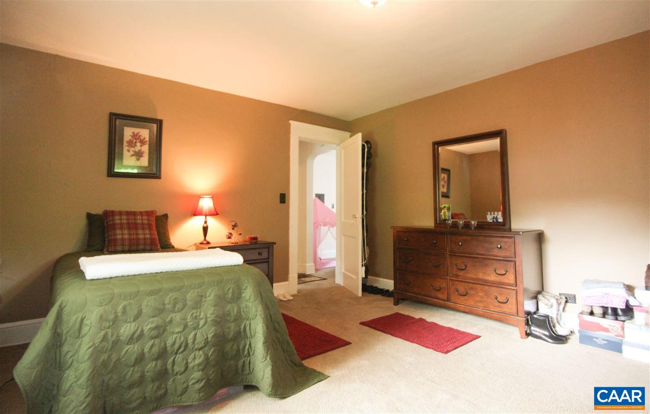 252 Shamrock Road Charlottesville, VA 22903 - Photo 12 of 18 a bedroom with a bed and a mirror on dresser