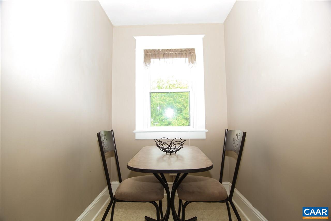 252 Shamrock Road Charlottesville, VA 22903 - Photo 5 of 18 a view of a dining room with furniture and a window