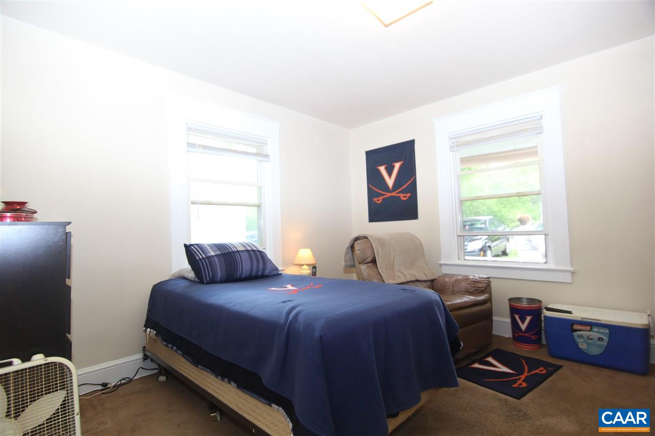 252 Shamrock Road Charlottesville, VA 22903 - Photo 8 of 18 a bedroom with a bed and a window