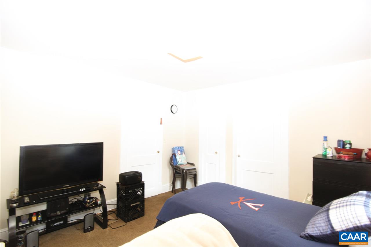 252 Shamrock Road Charlottesville, VA 22903 - Photo 10 of 18 a workspace with furniture and flat screen tv