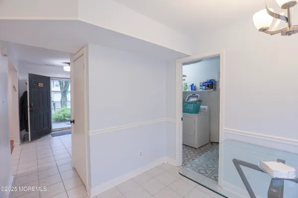 a view of an entryway and livingroom in right side