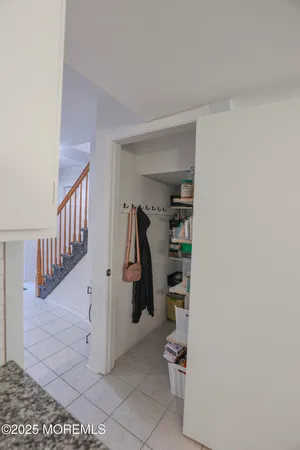 a view of a hallway with entryway to other room
