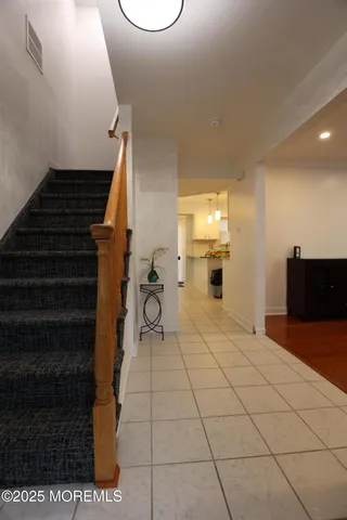 a bedroom with two beds and a closet