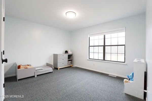 a room with a bed and a window