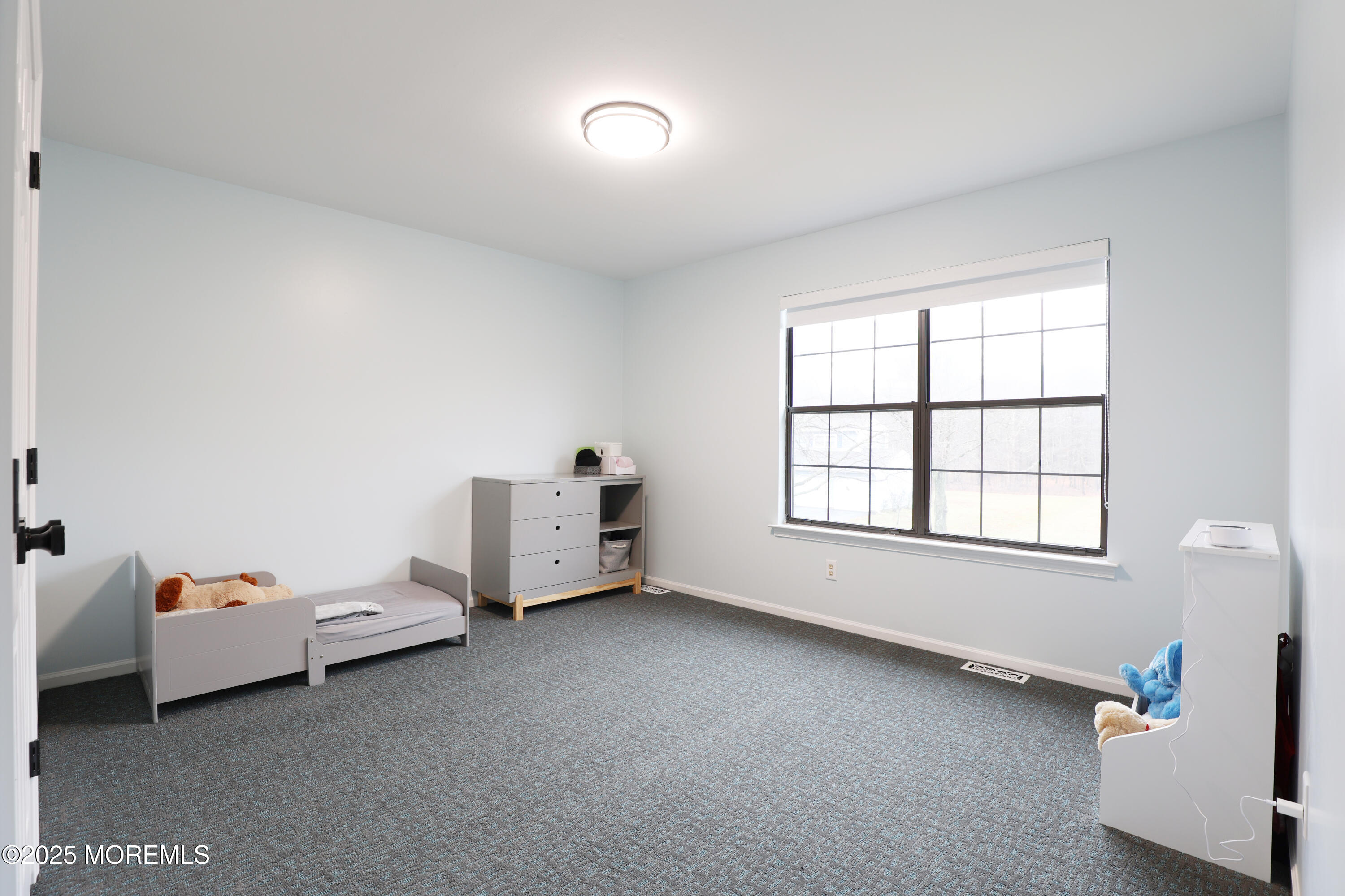 302 Princeton Drive Howell, NJ 07731 - Photo 24 of 30 a room with a bed and a window