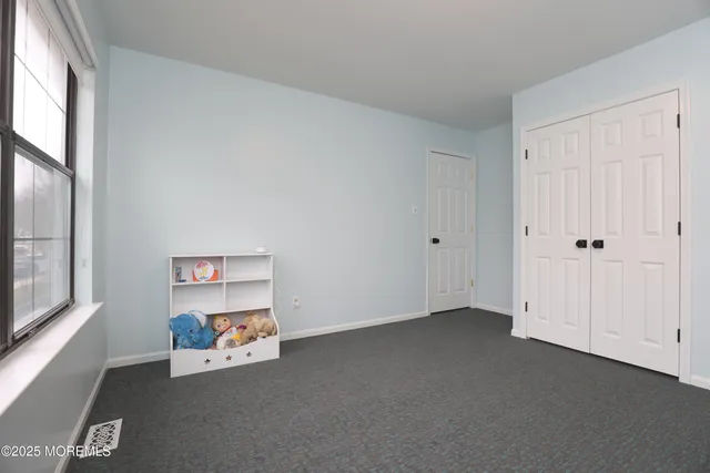 a view of a white house with a yard