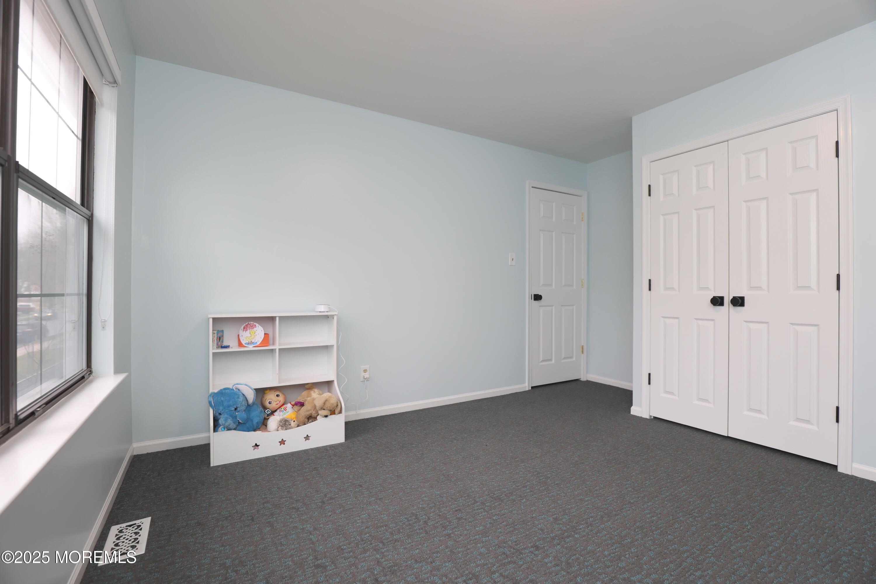 302 Princeton Drive Howell, NJ 07731 - Photo 25 of 30 an empty room with windows