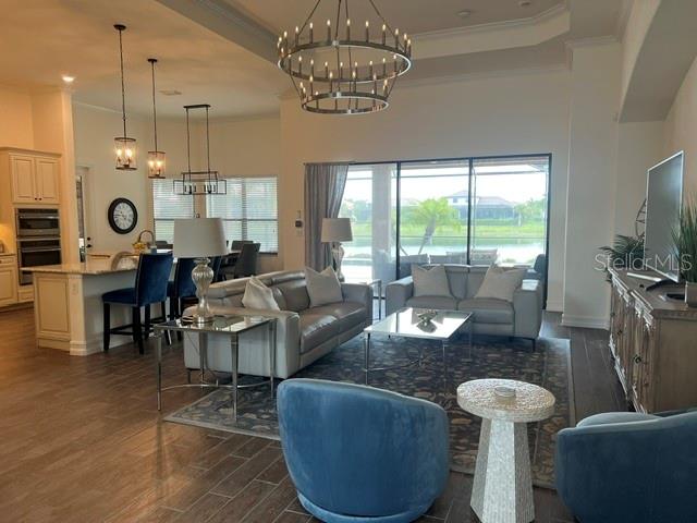 5528 Arnie Loop Lakewood Ranch, FL 34211 - Photo 2 of 59 a living room with furniture and a large window