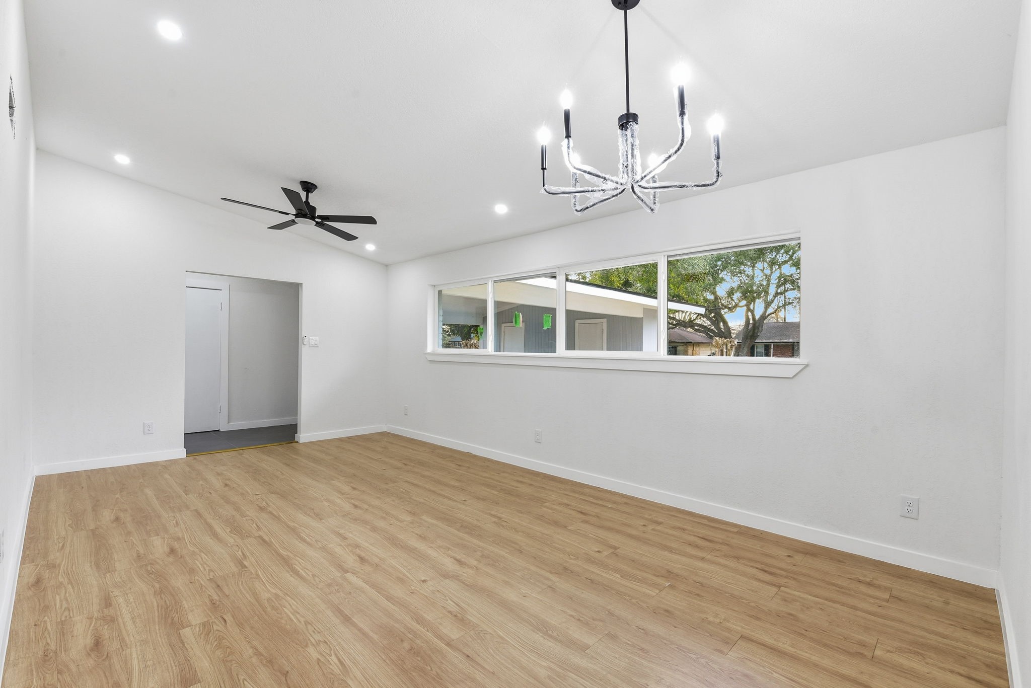 12319 Renwick Houston, TX 77035 - Photo 16 of 50 a view of an empty room with a chandelier