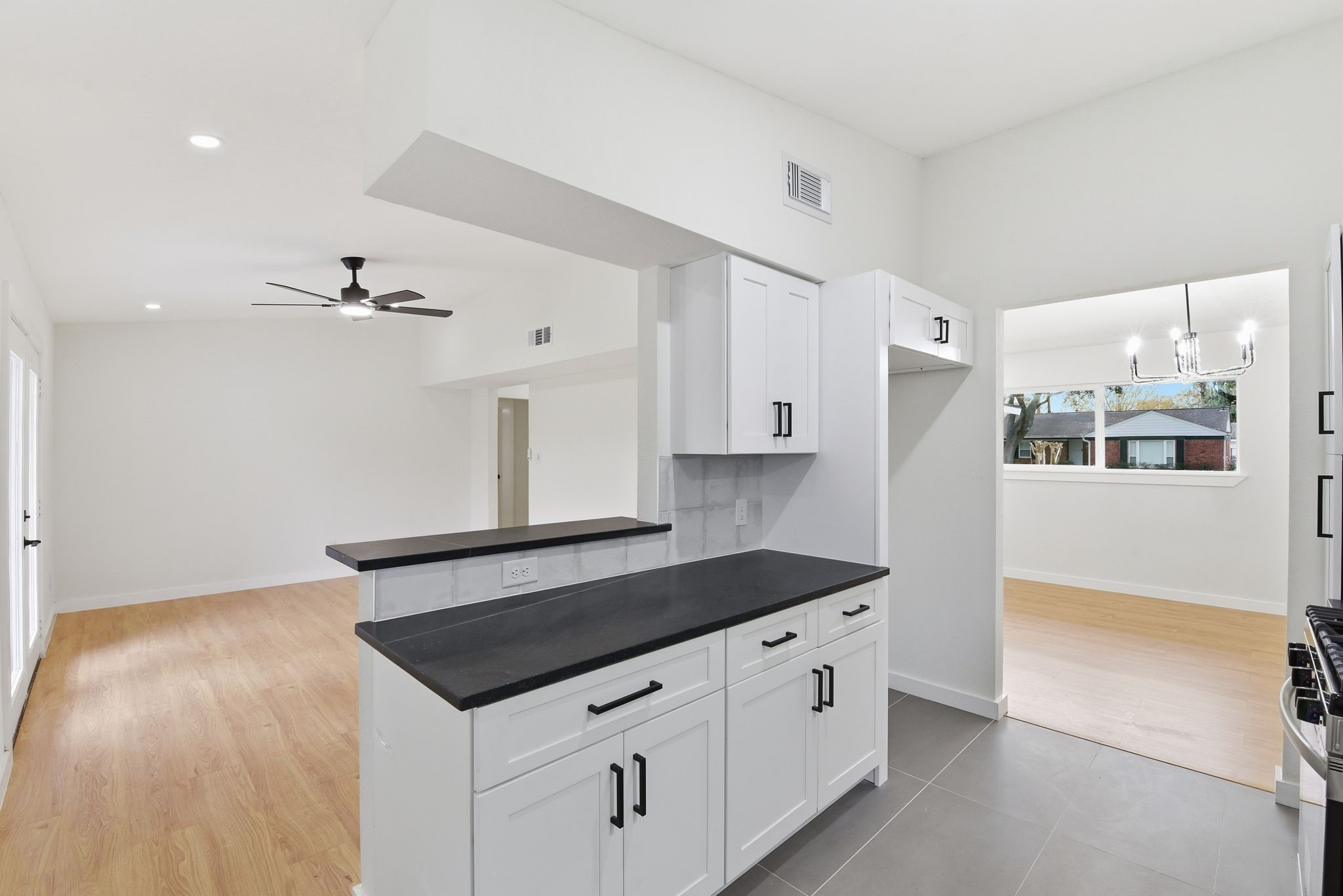 12319 Renwick Houston, TX 77035 - Photo 21 of 50 a kitchen with granite countertop a sink and a stove top oven