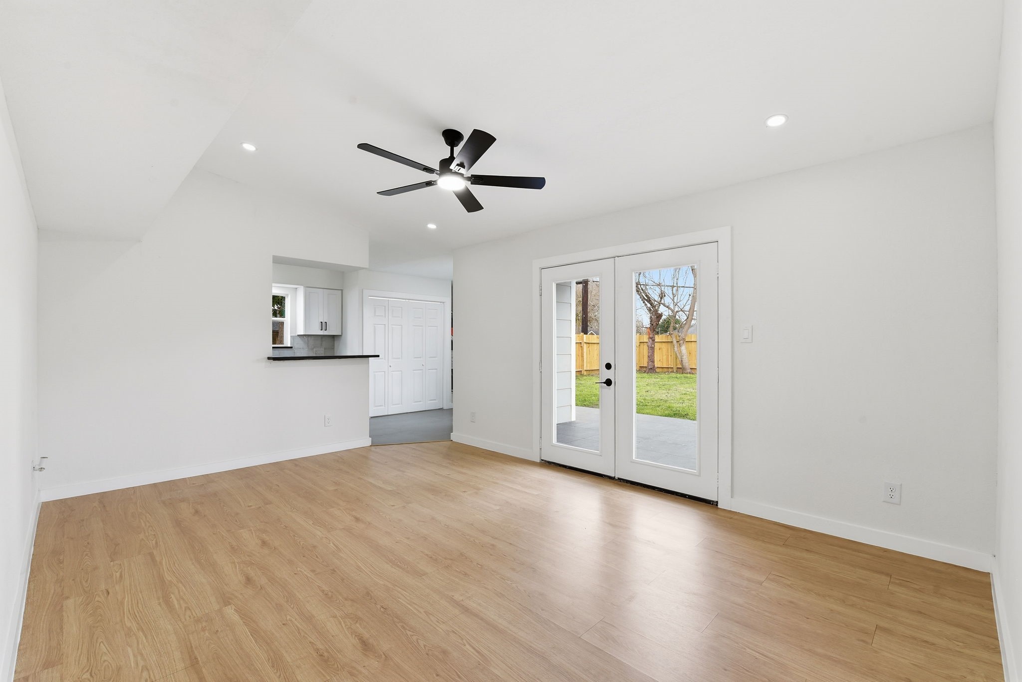 12319 Renwick Houston, TX 77035 - Photo 22 of 50 a view of empty room with wooden floor and ceiling fan