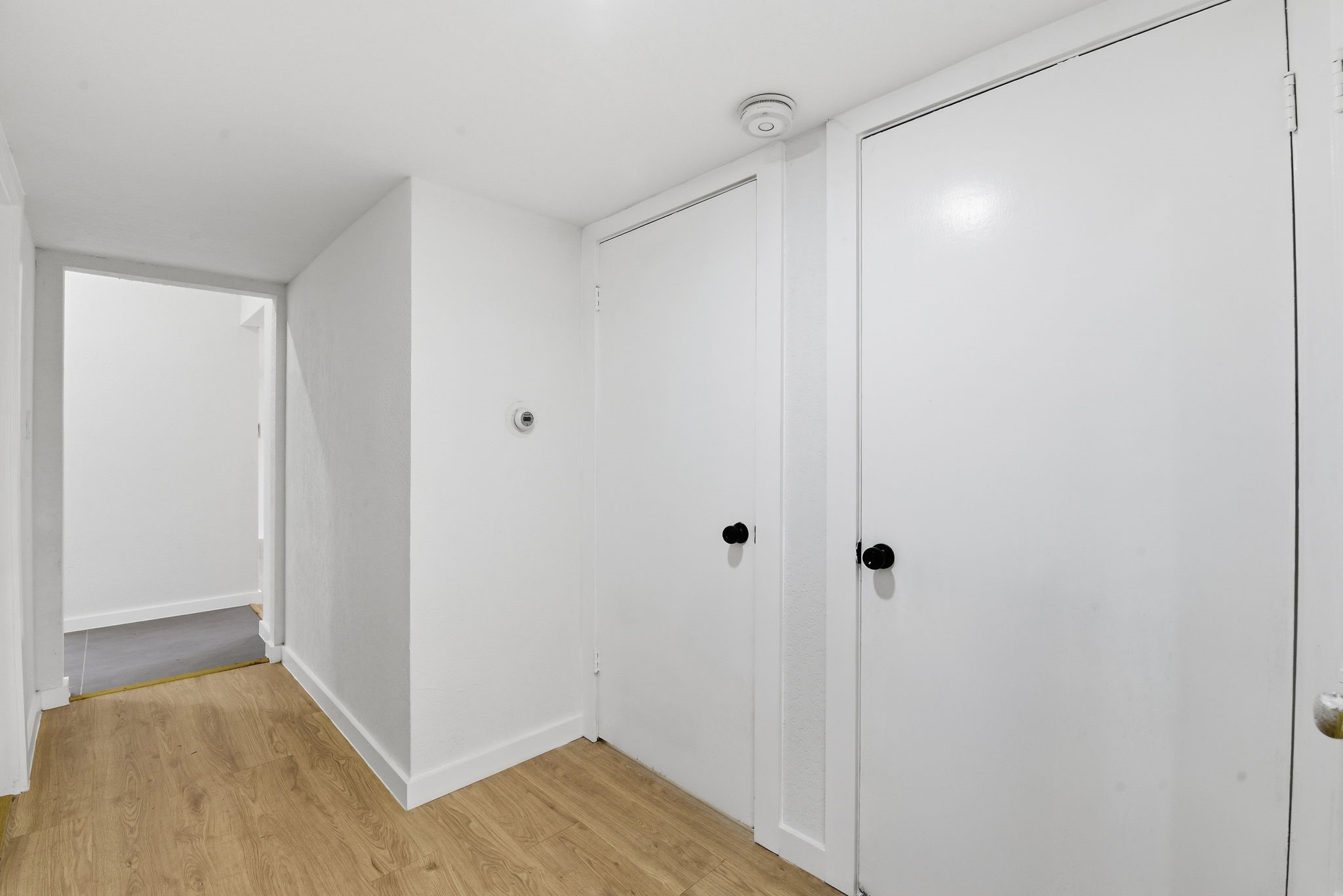 12319 Renwick Houston, TX 77035 - Photo 25 of 50 a view of a hallway with wooden floor