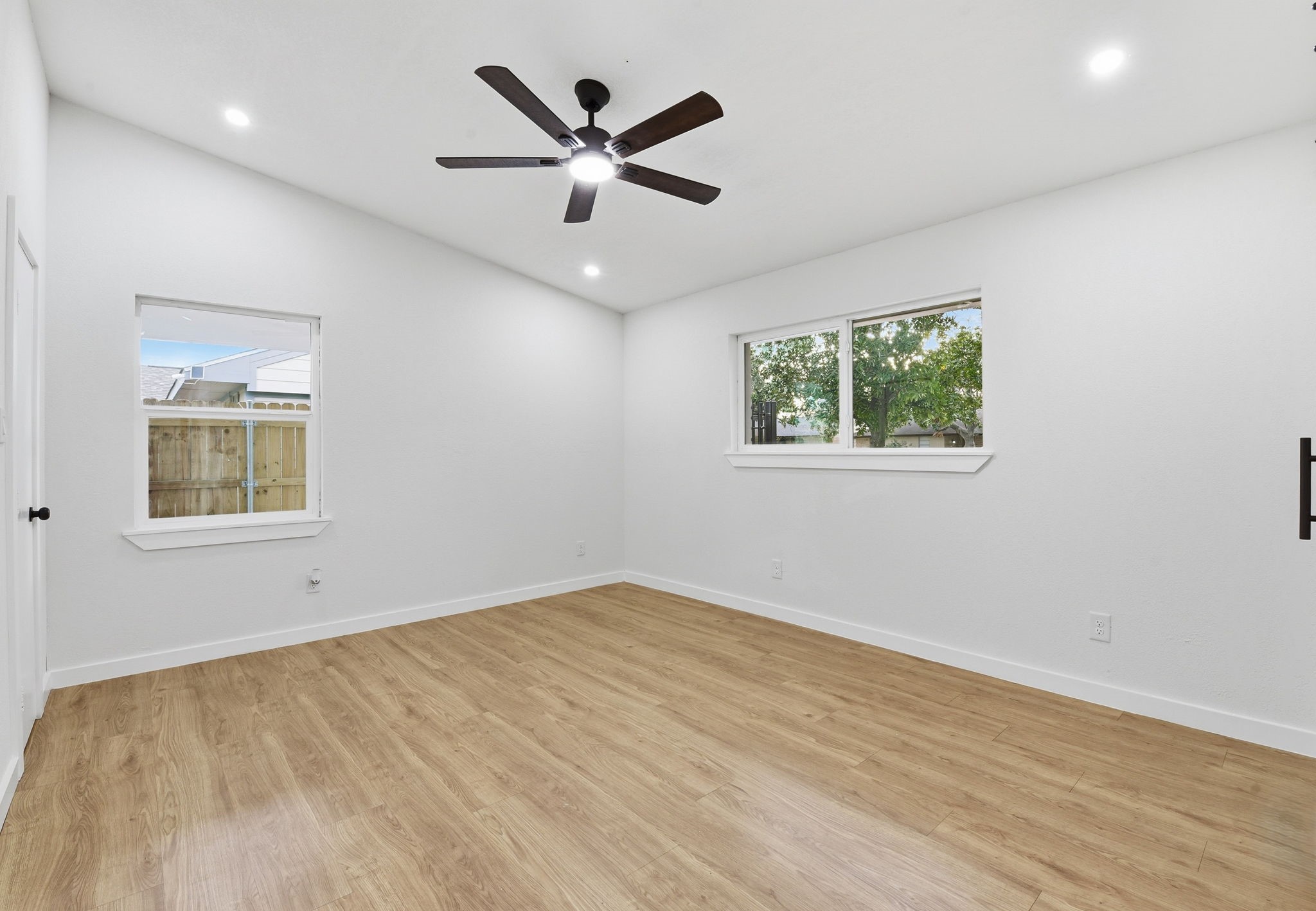 12319 Renwick Houston, TX 77035 - Photo 30 of 50 an empty room with wooden floor and windows