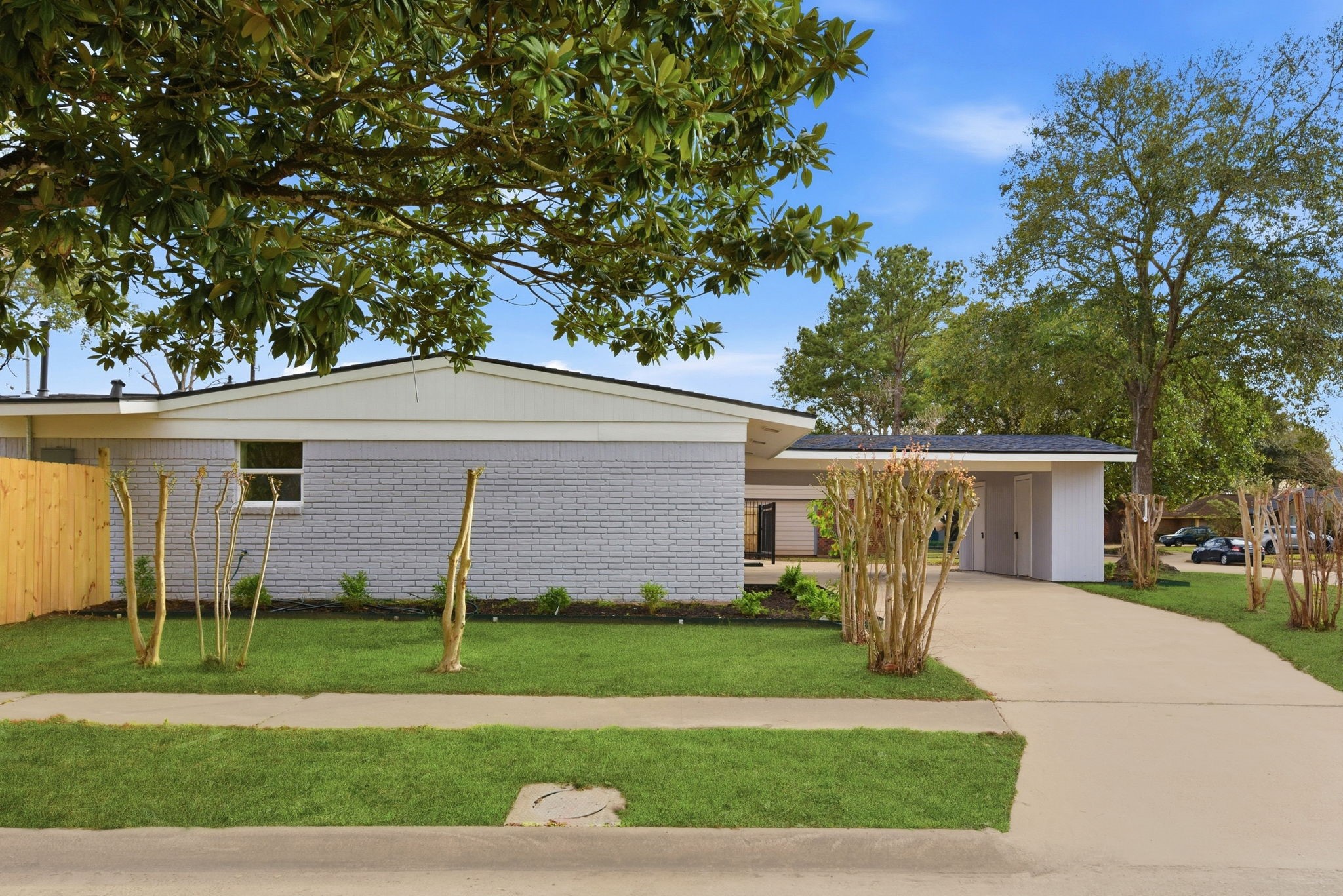 12319 Renwick Houston, TX 77035 - Photo 5 of 50 a front view of a house with a yard and a garage