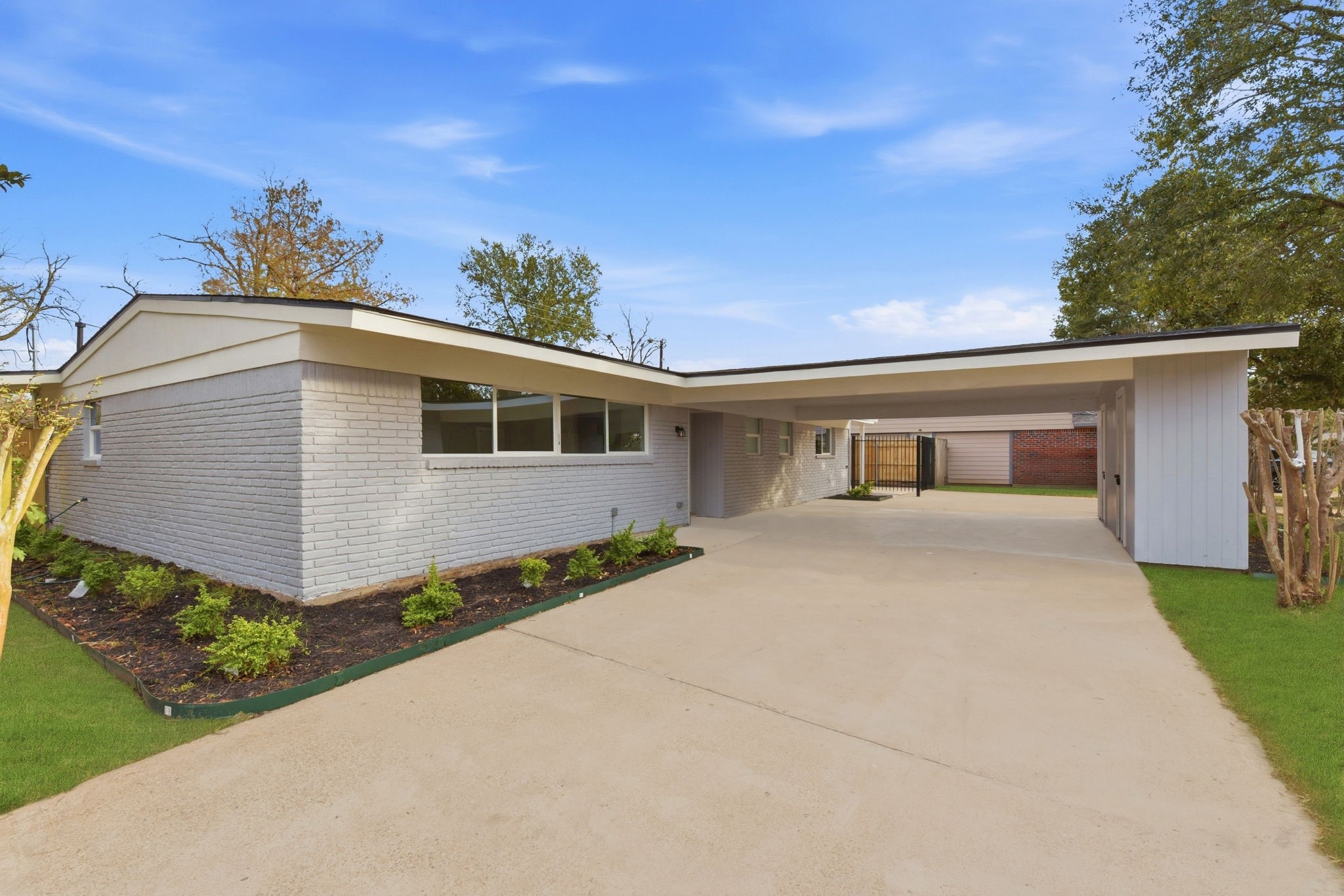 12319 Renwick Houston, TX 77035 - Photo 6 of 50 a front view of a house with a yard and garage