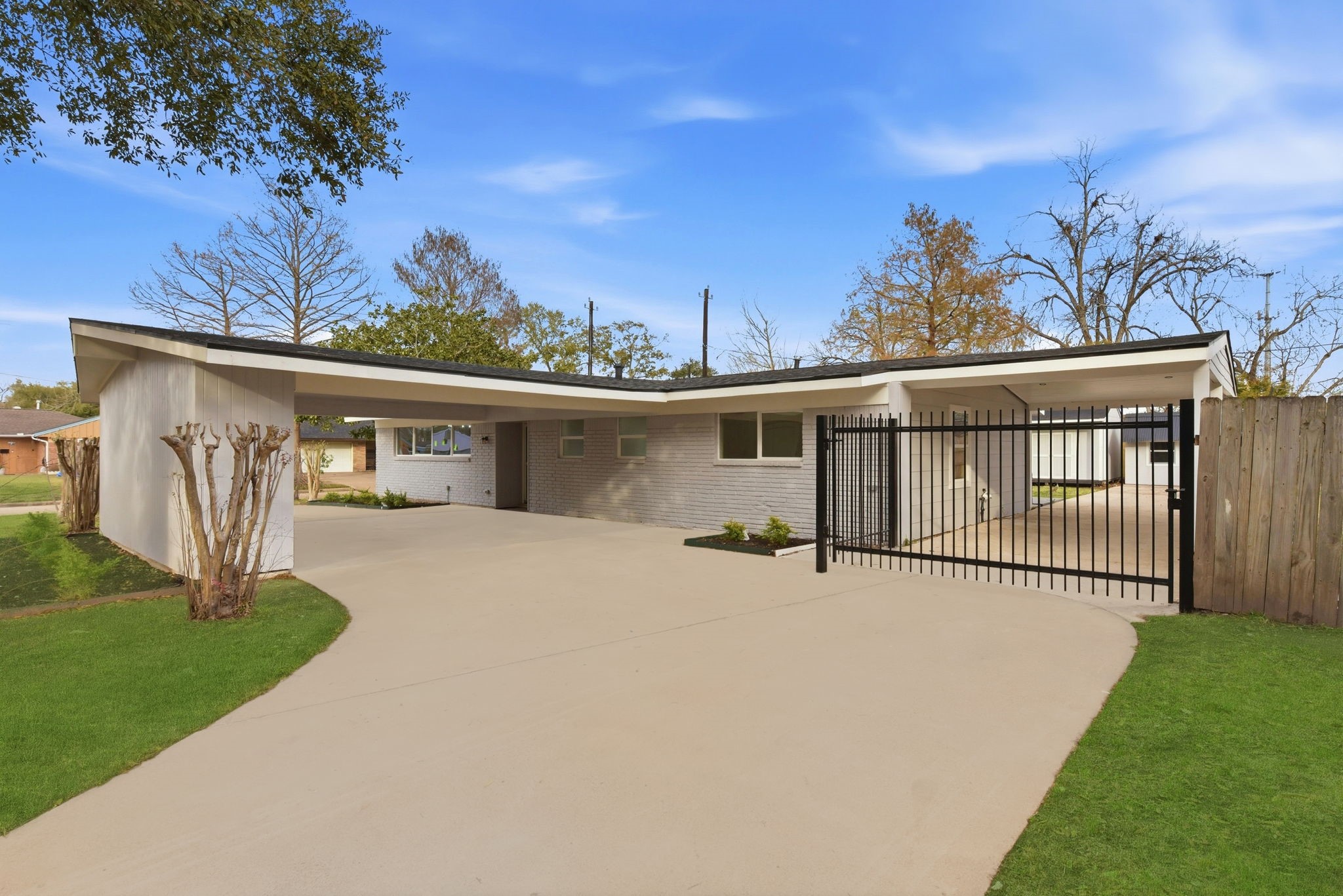 12319 Renwick Houston, TX 77035 - Photo 8 of 50 a front view of a house with a yard and garage
