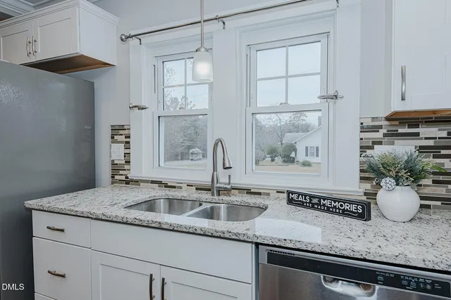 a kitchen with sink and window