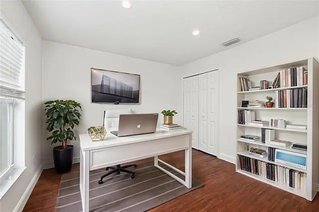 a room with furniture and a bookshelf