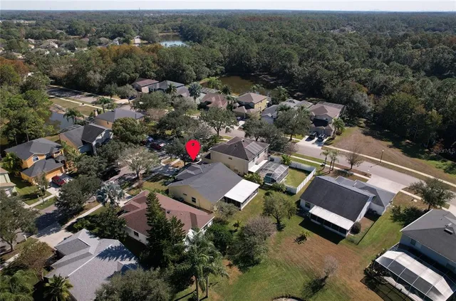 an aerial view of a house with a garden