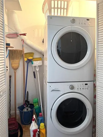 a close view of a utility room with dryer and washer