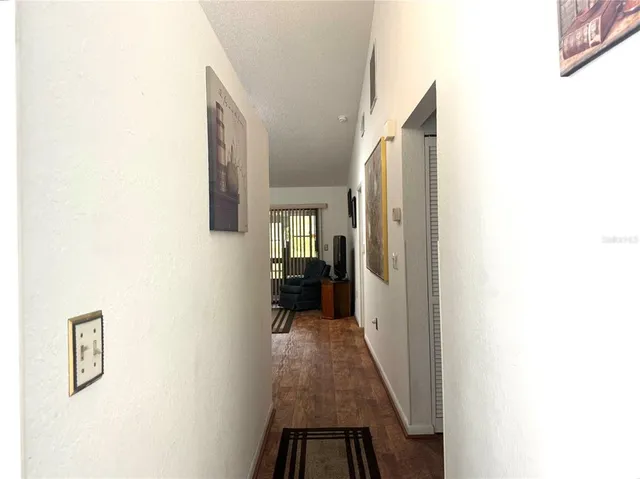a view of a hallway with a white walls