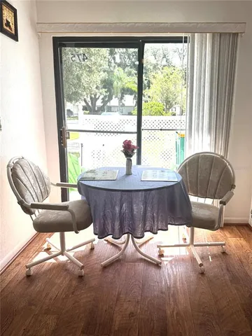 a living room with a large window and a table