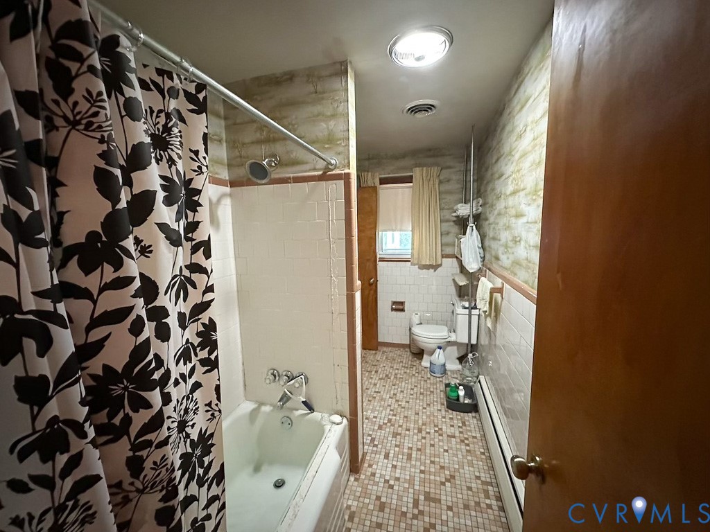 9701 Old Stage Road Prince George, VA 23875 - Photo 13 of 29 a bathroom with a sink and a shower