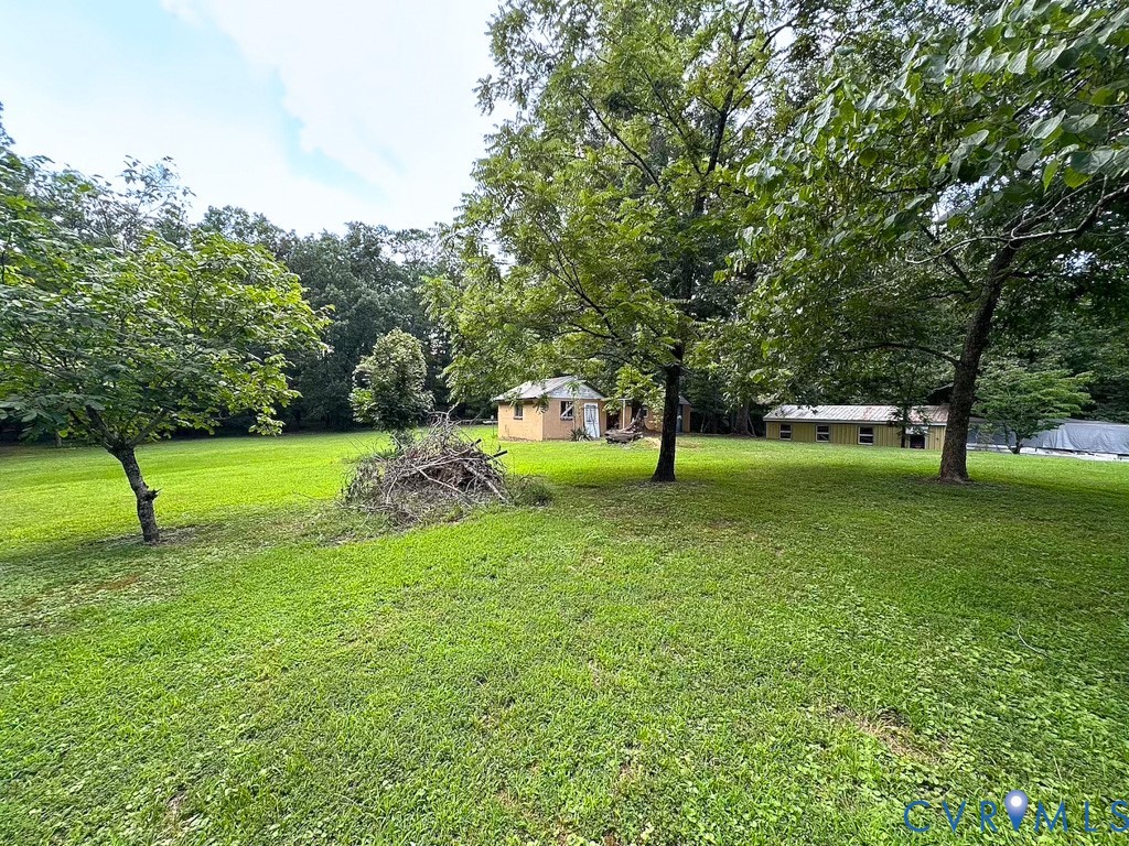 9701 Old Stage Road Prince George, VA 23875 - Photo 16 of 29 a garden view with a sitting space