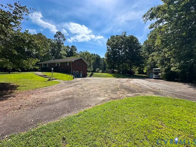 a view of a backyard with swimming pool