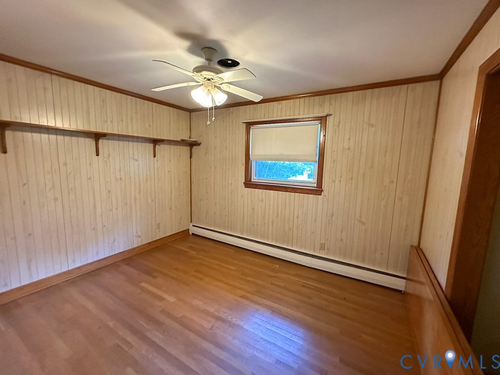9701 Old Stage Road Prince George, VA 23875 - Photo 9 of 29 a view of an empty room with wooden floor and a window
