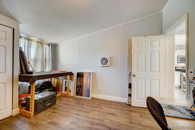 a view of a livingroom with furniture and staircase