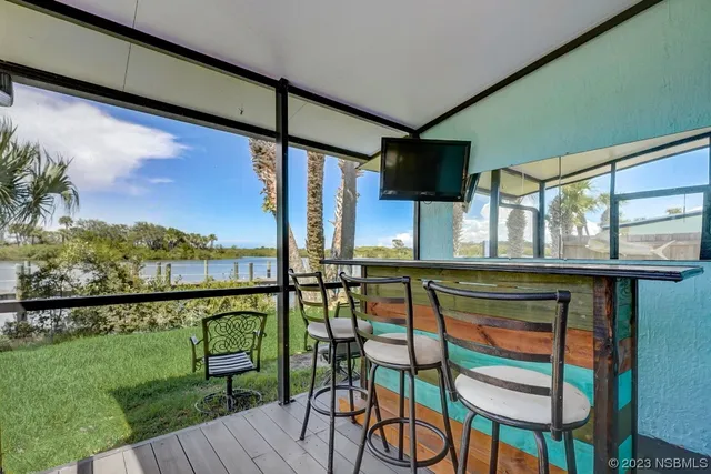 a view of balcony with furniture
