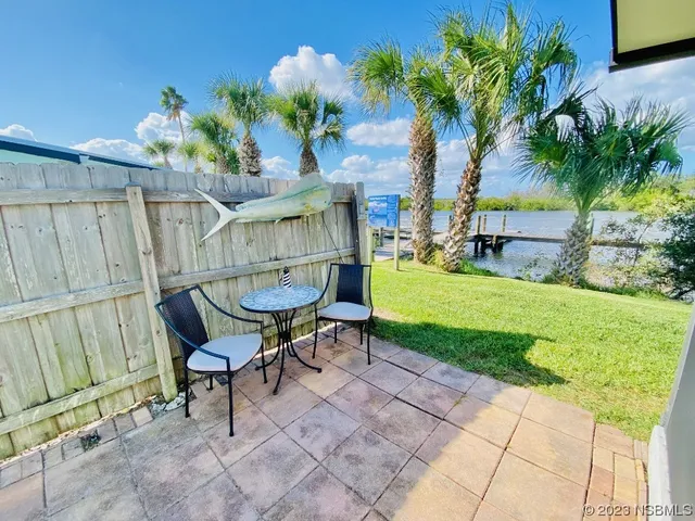 a view of a chairs and table in the garden