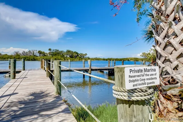 a view of a lake with furniture
