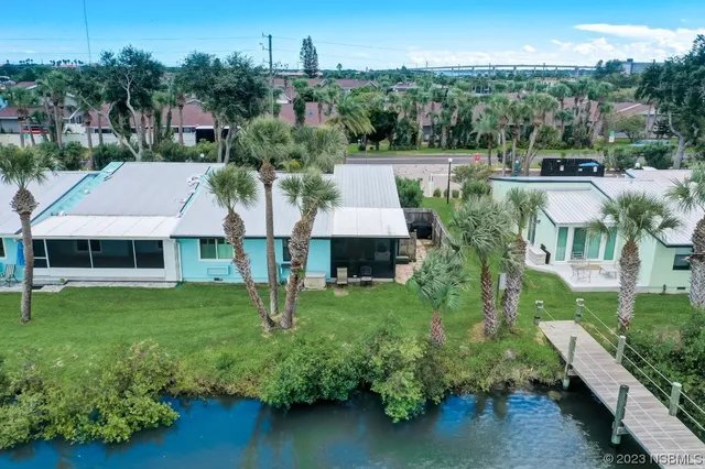 an aerial view of a house with a swimming pool