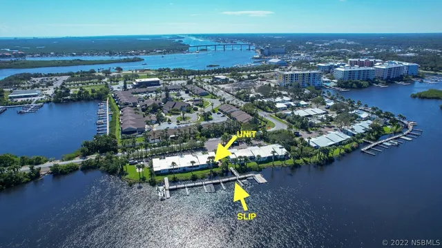 an aerial view of a house with a swimming pool yard and outdoor seating