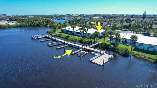an aerial view of a house with a lake view