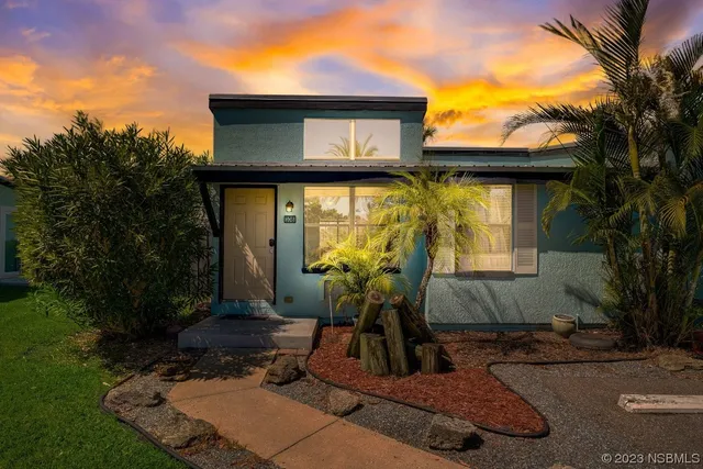 a house view with a garden space